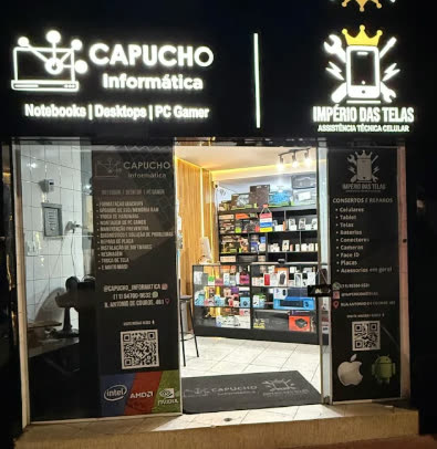 Fachada da loja Império das Telas à noite